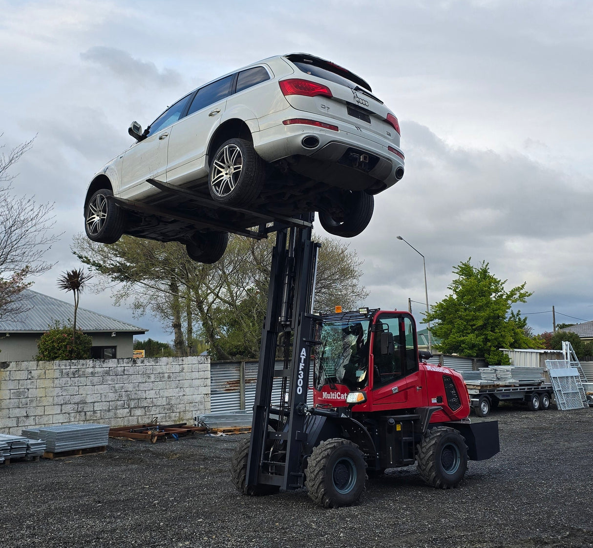 Car on a tow truck with a snowy landscape in the background
